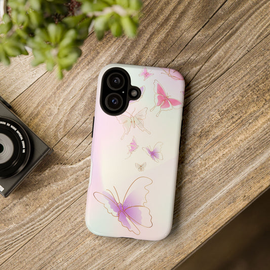 Printed mobile phone  cases new york A phone case with a colorful butterfly design, lying on a wooden surface next to a camera and a mobile phone.
